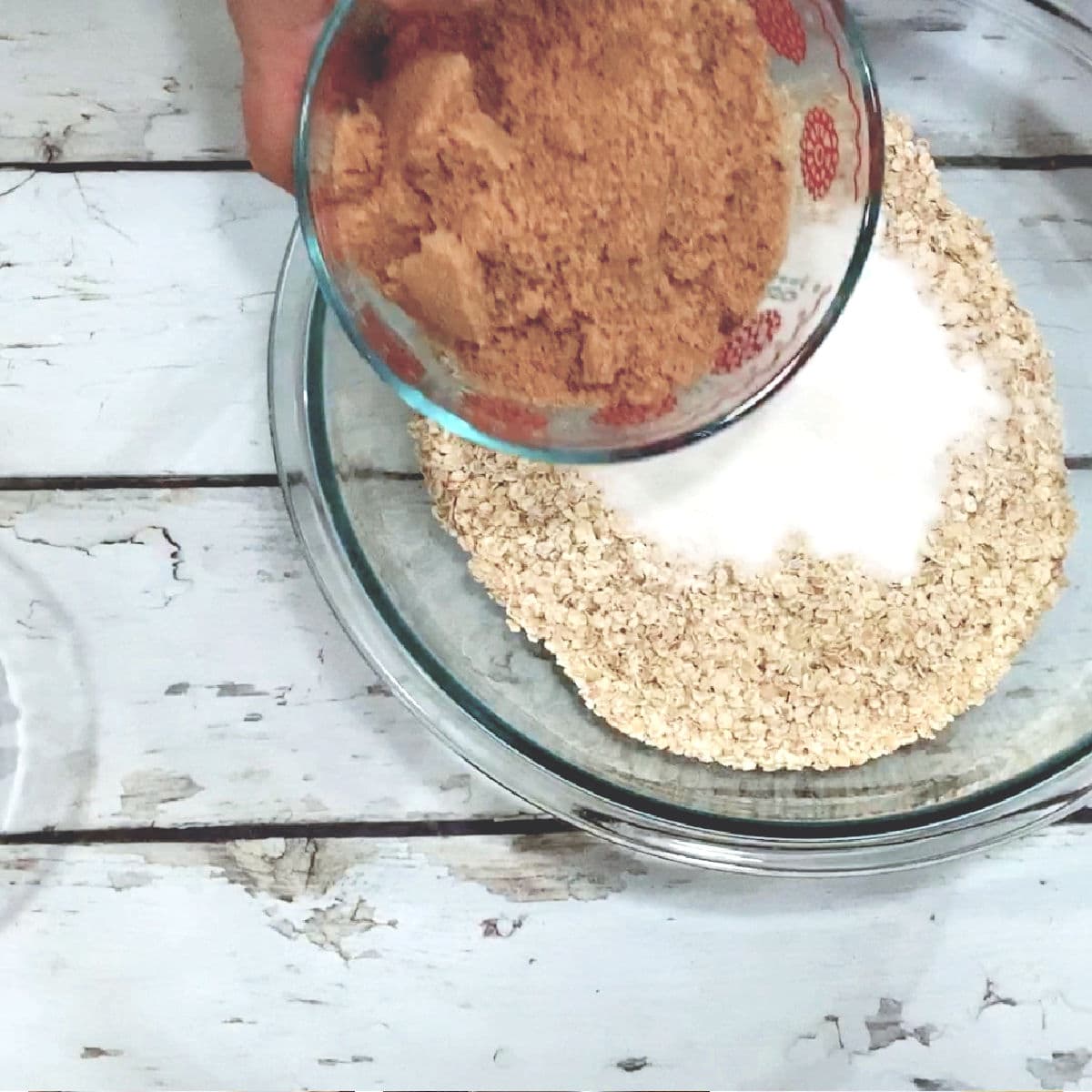 Add both sugars and the oatmeal to a bowl.