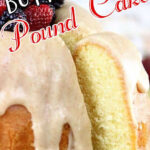 A pound cake with berries on top. Text overlay for Pinterest.