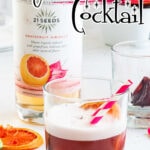 A tequila and grapefruit cocktail with a text overlay for Pinterest.