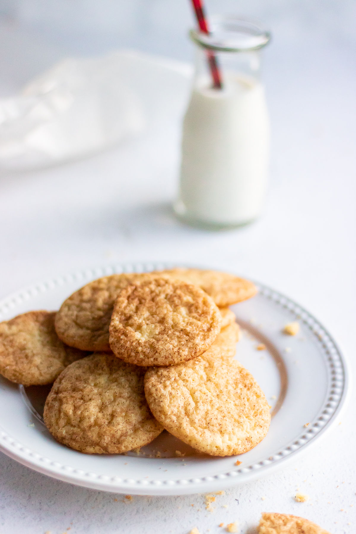 Classic snickerdoodles on a white plate.