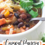 Close up of black bean soup in a white bowl with text overlay for Pinterest.