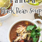 Overhead view of black bean soup in a white bowl with a text overlay for Pinterest.