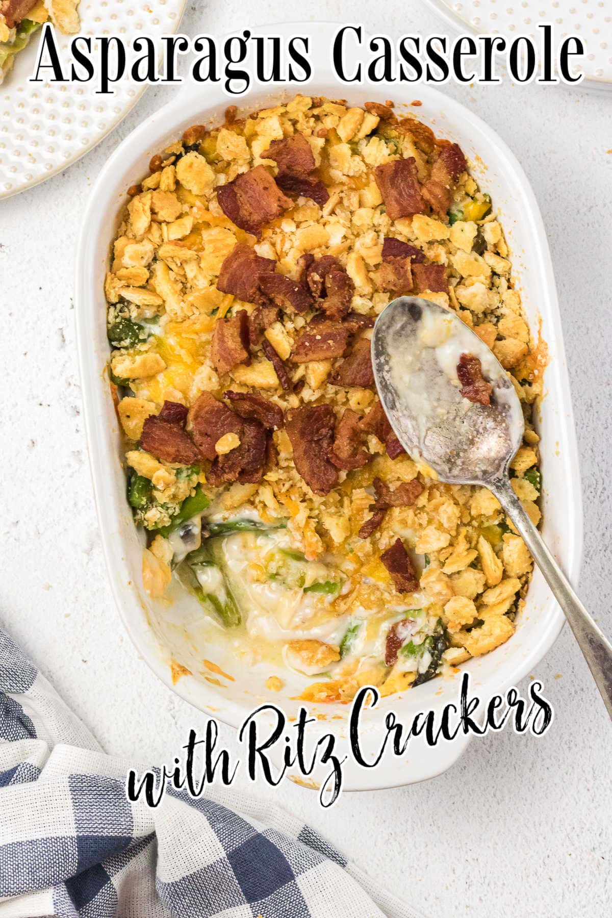 Overhead view of asparagus casserole with a serving removed. Title text overlay.