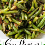 Over head view of a bowl of green beans and bacon with a text overlay for Pinterest.