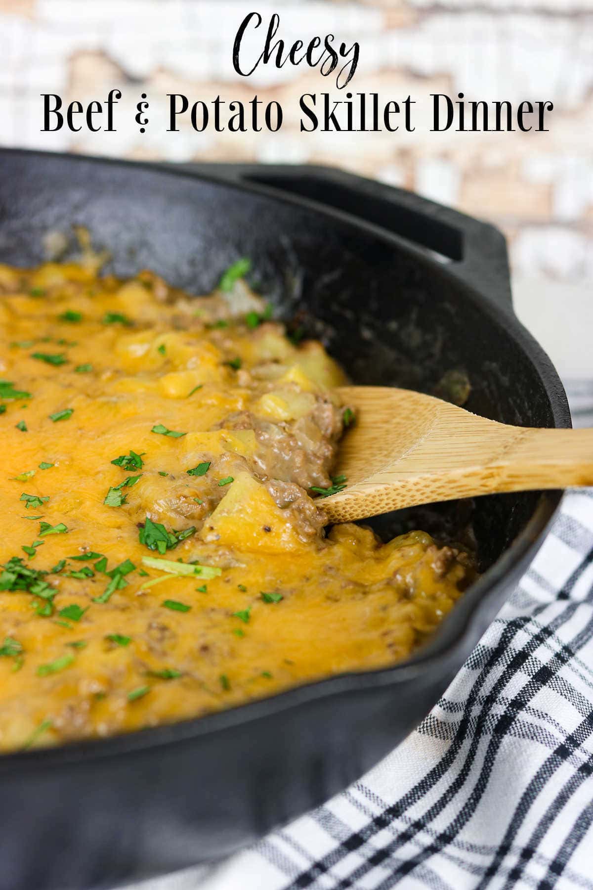 Title image. A cast iron skillet filled with a creamy beef and potato mixture.