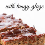 Homemade meatloaf with a tomato glaze on a serving dish. Text overlay for pinning to Pinterest.
