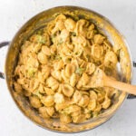 Overhead view of a pan of pasta with broccoli.