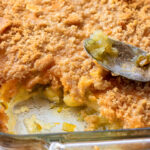 Very close shot of pineapple casserole showing the texture of the cracker crumb topping.