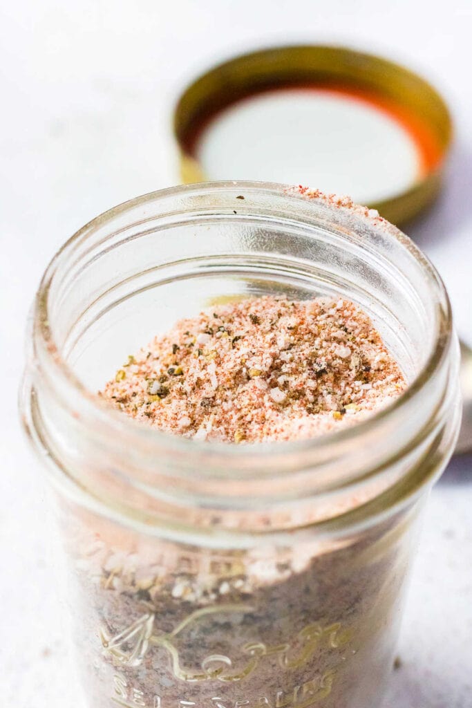 Copycat Popeye's Chicken Seasoning in a jar with the cover off.