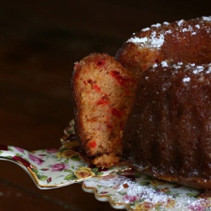 Whiskey Sour Cake with a slice being removed.