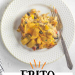 Overhead view of Frito Casserole on a plate with a fork nearby. Text overlay for Pinterest