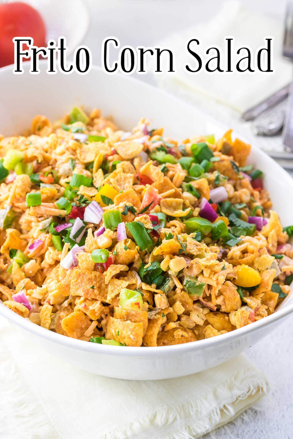 Frito corn salad in a white serving bowl with text overlay.