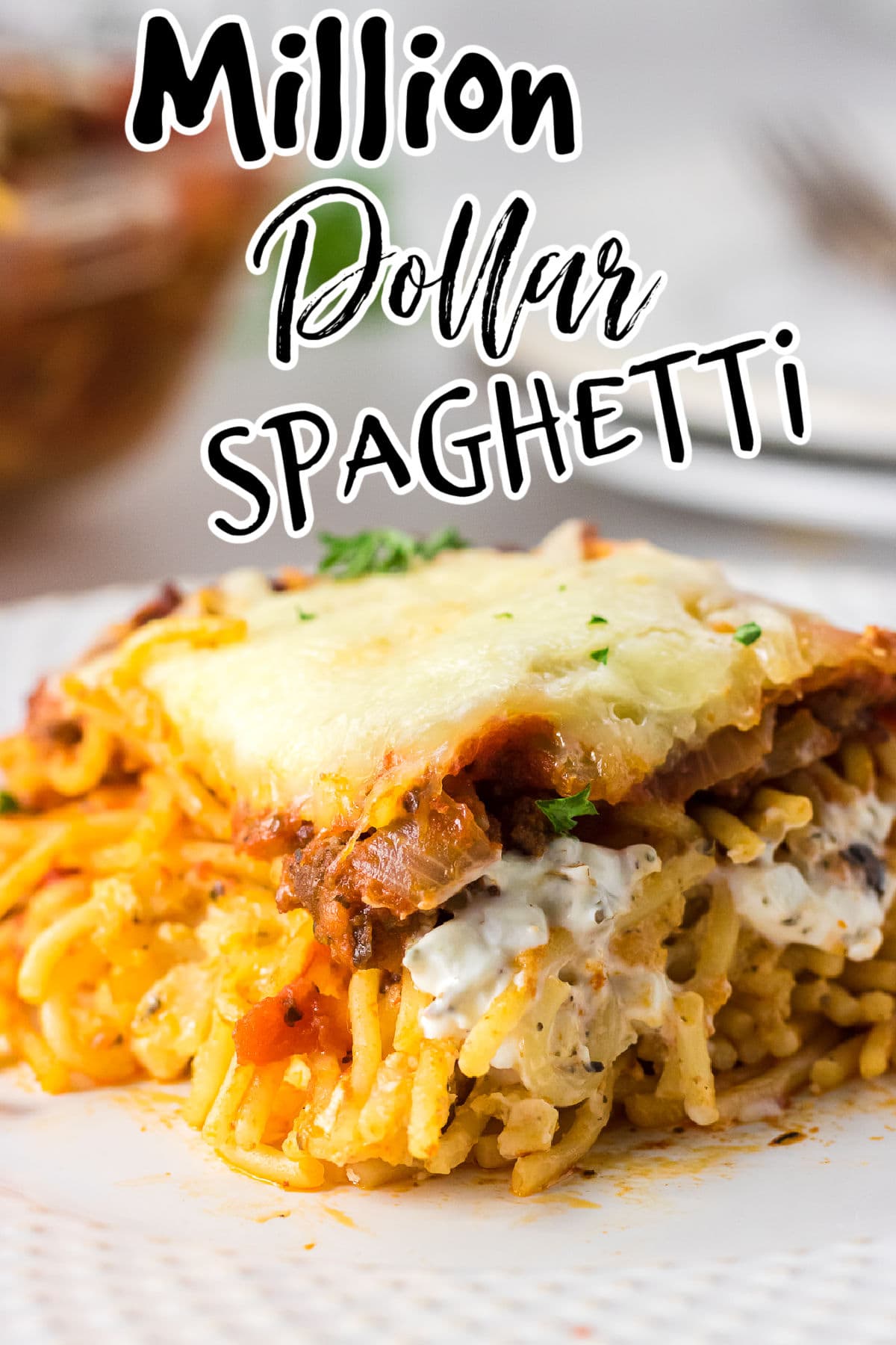 Closeup of a serving of spaghetti casserole with title text overlay.