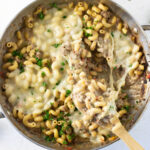 Overhead view of cheesesteak pasta with cheese melted on top.