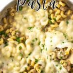 Overhead view of a pan of cheesy pasta with title text overlay.