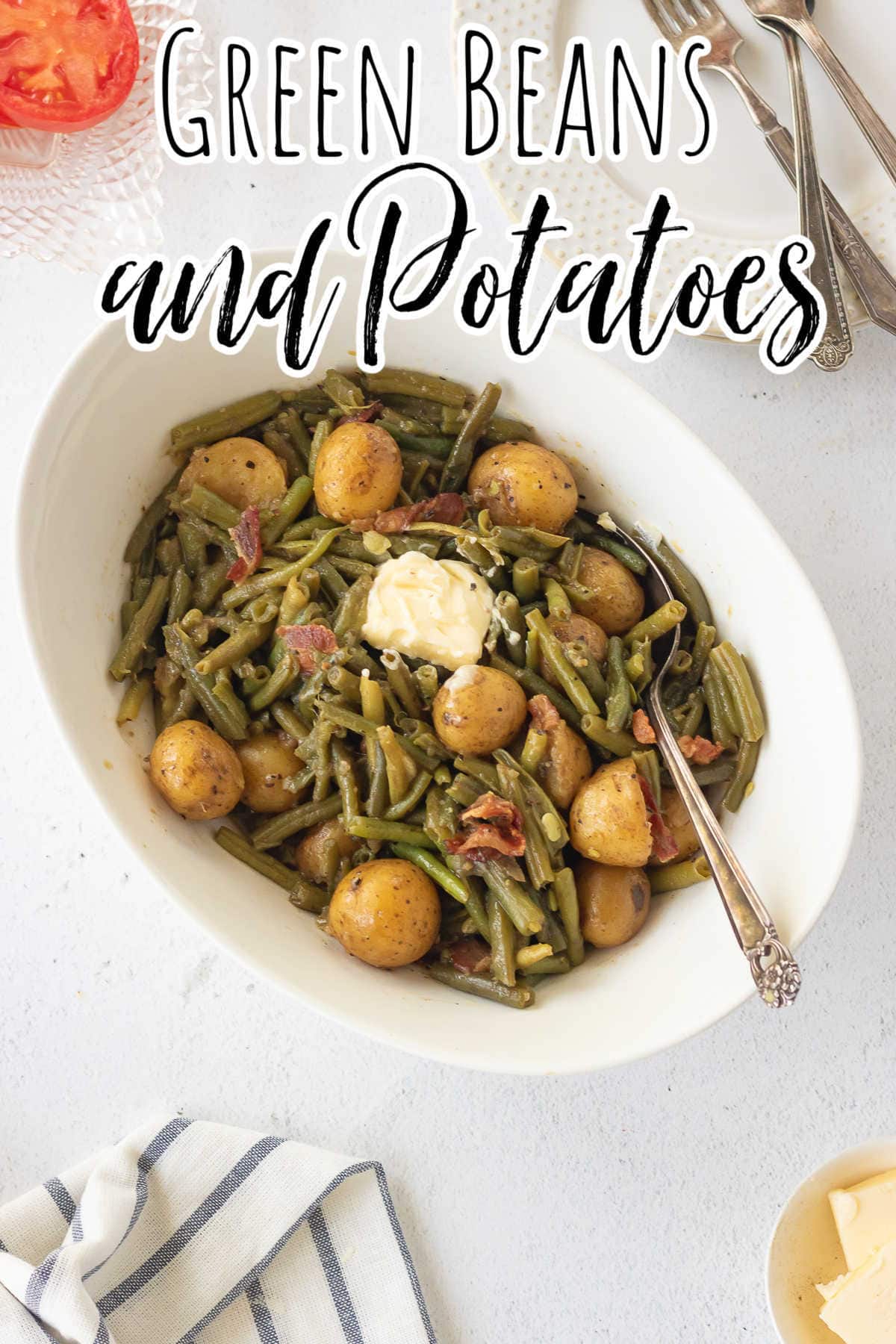 Overhead view of a serving bowl of green beans and potatoes with text overlay for Pinterest.