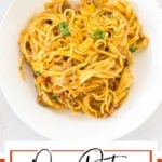 A plate of taco spaghetti with a text overlay for Pinterest