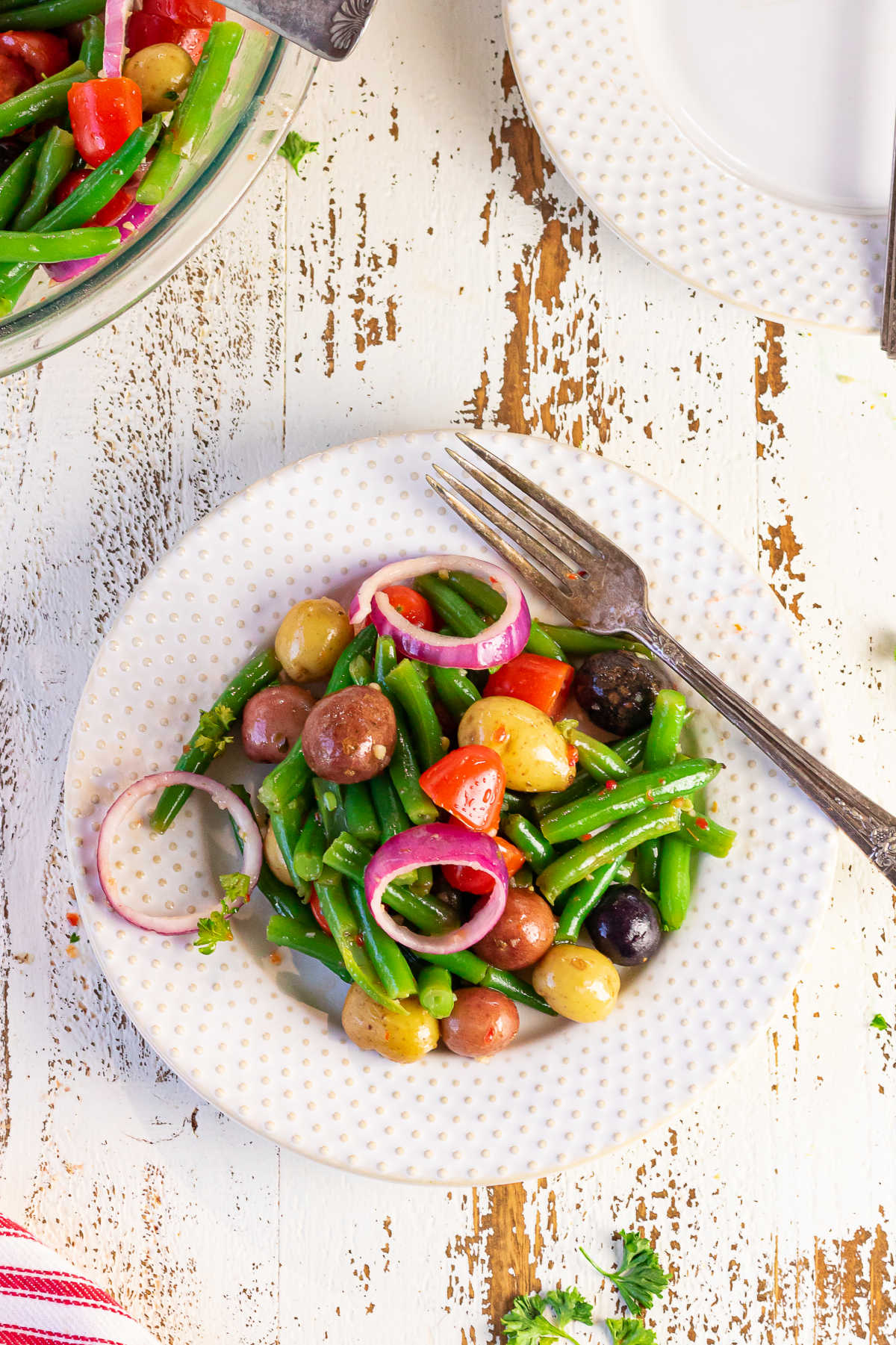 Decorative image showing a plate of green bean salad.