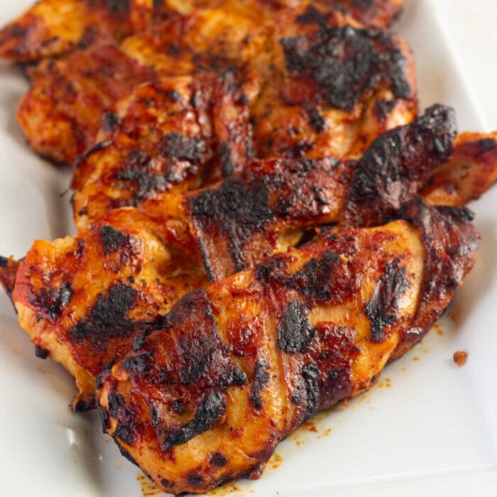 Close up of chicken breast that's been grilled.