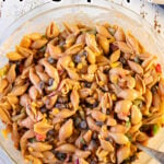 Overhead view of a bowl of macaroni salad with a text overlay for Pinterest.