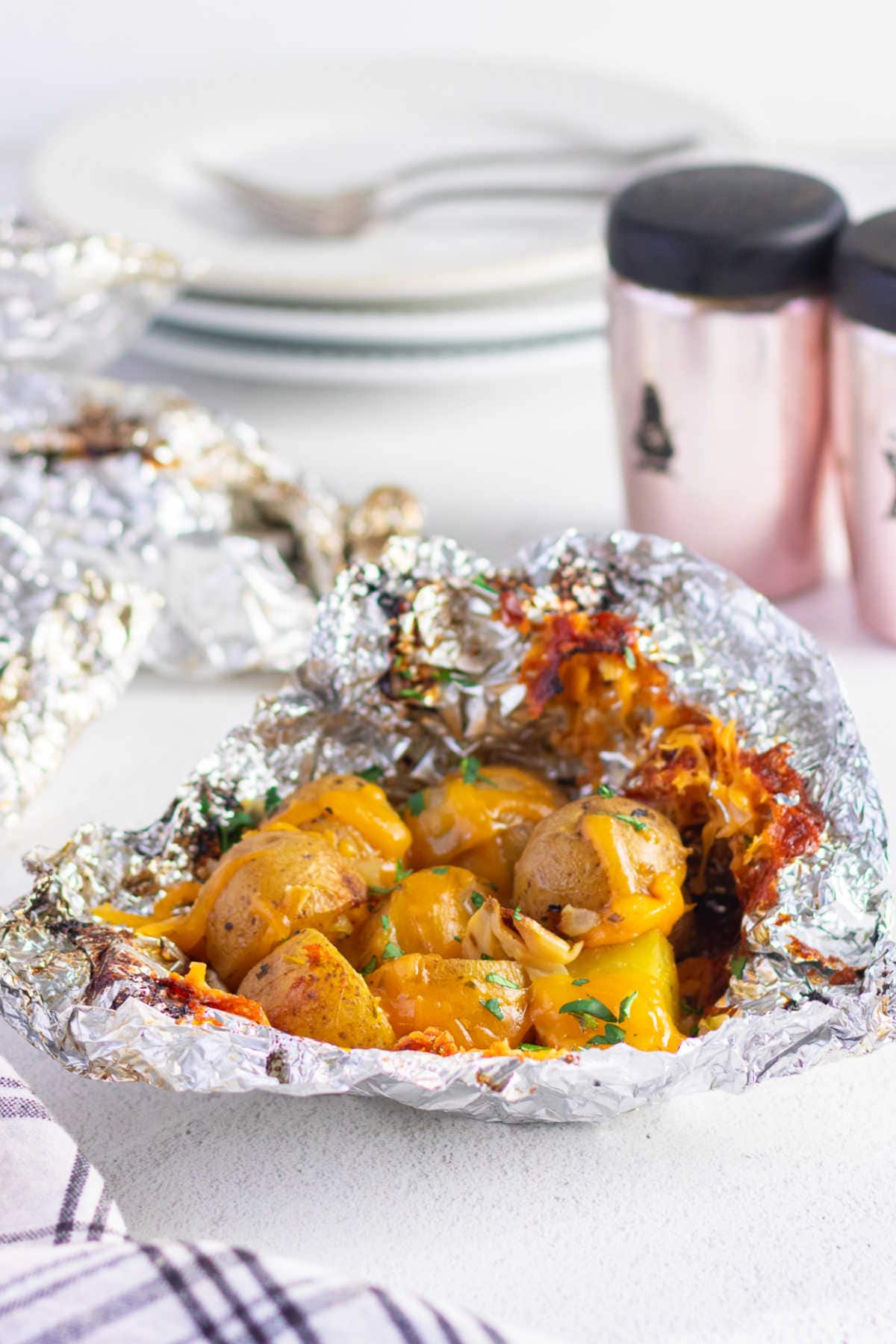 Potato packets are opened on the table ready to eat.