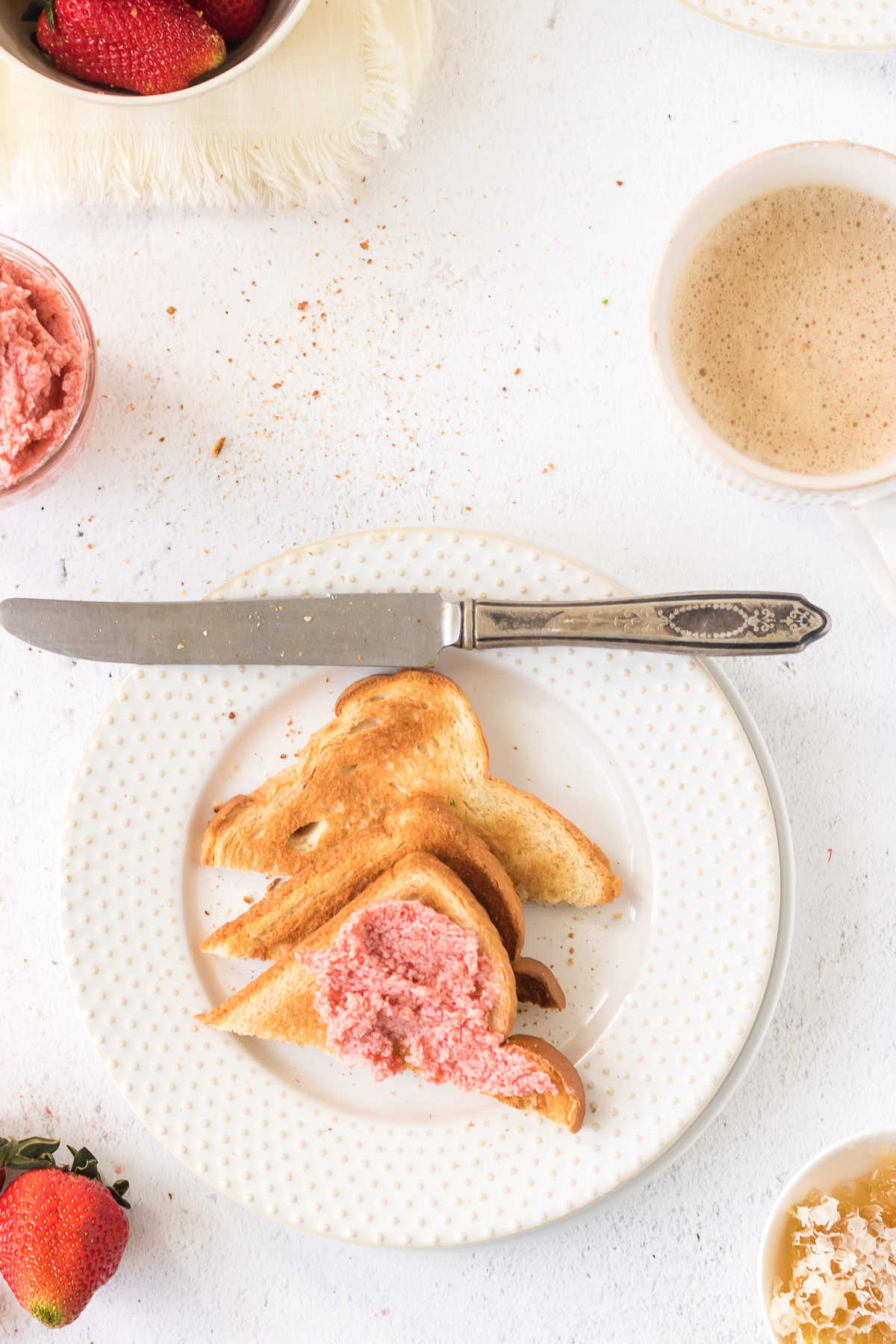 Overhead view of strawberry butter on toast.