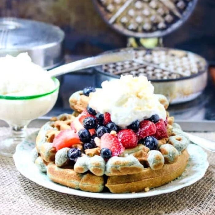 Waffles with berries on top.