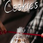 Woman tying a bow on a package of cookies with text overlay for Pinterest.