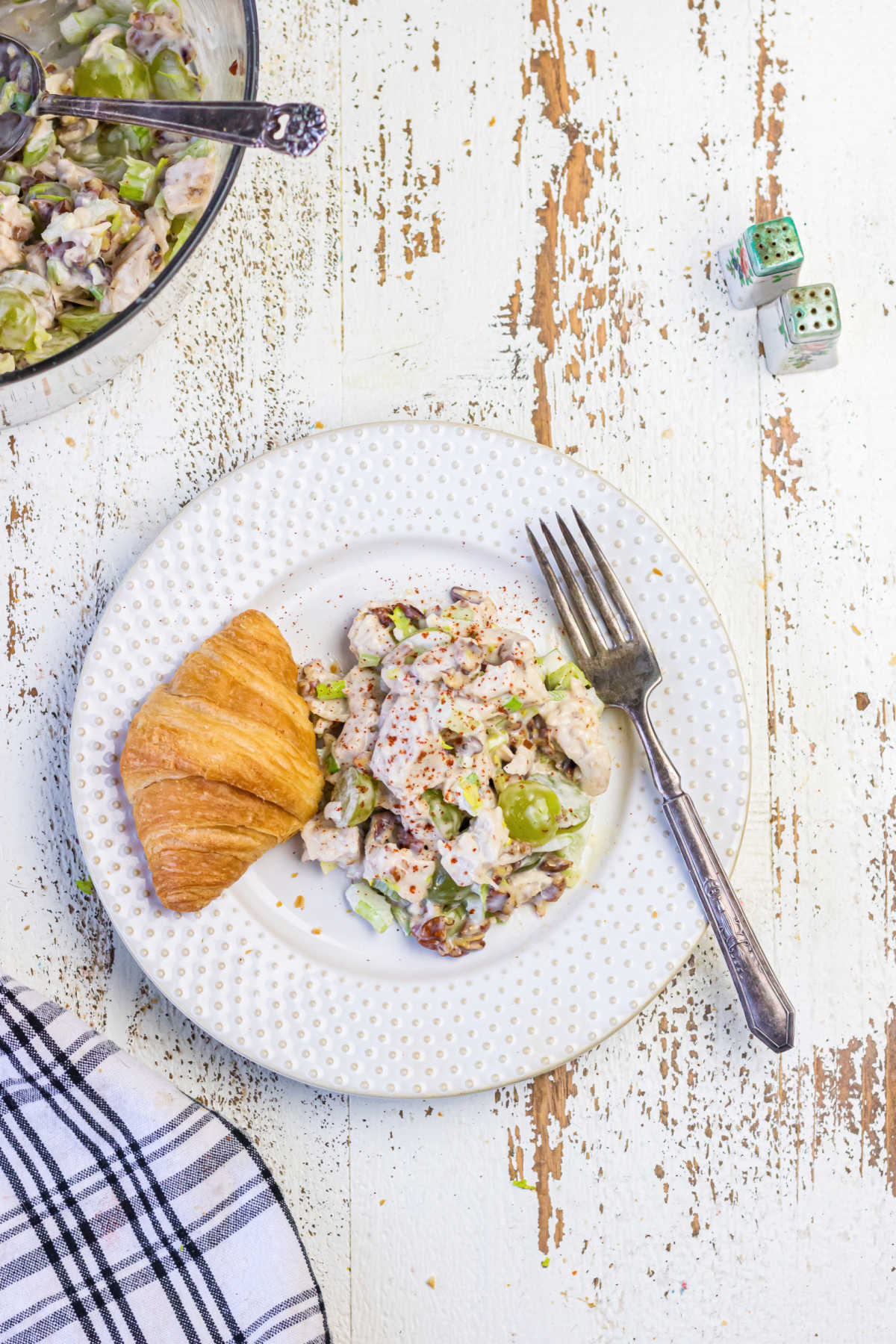 Decorative image. Overhead view of chicken salad on a white plate.