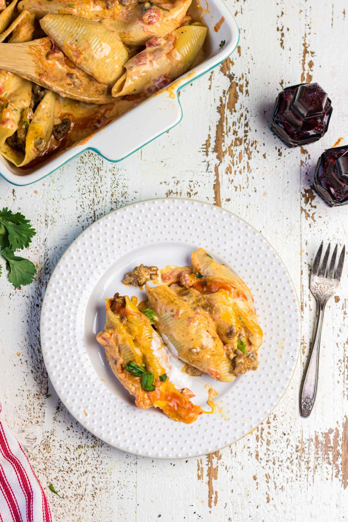 Decorative image. Overhead view of stuffed shells on a plate.