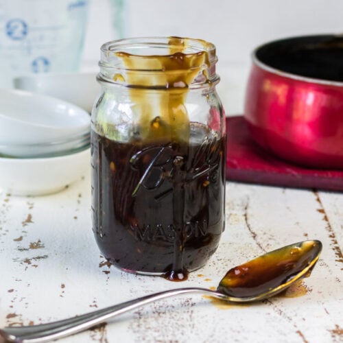 Side view of a jar full of the homemade sauce.