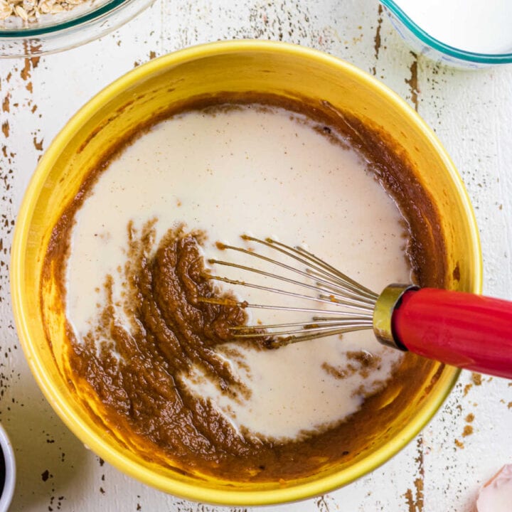 Mixing the milk and pumpkin for pumpkin baked oatmeal.