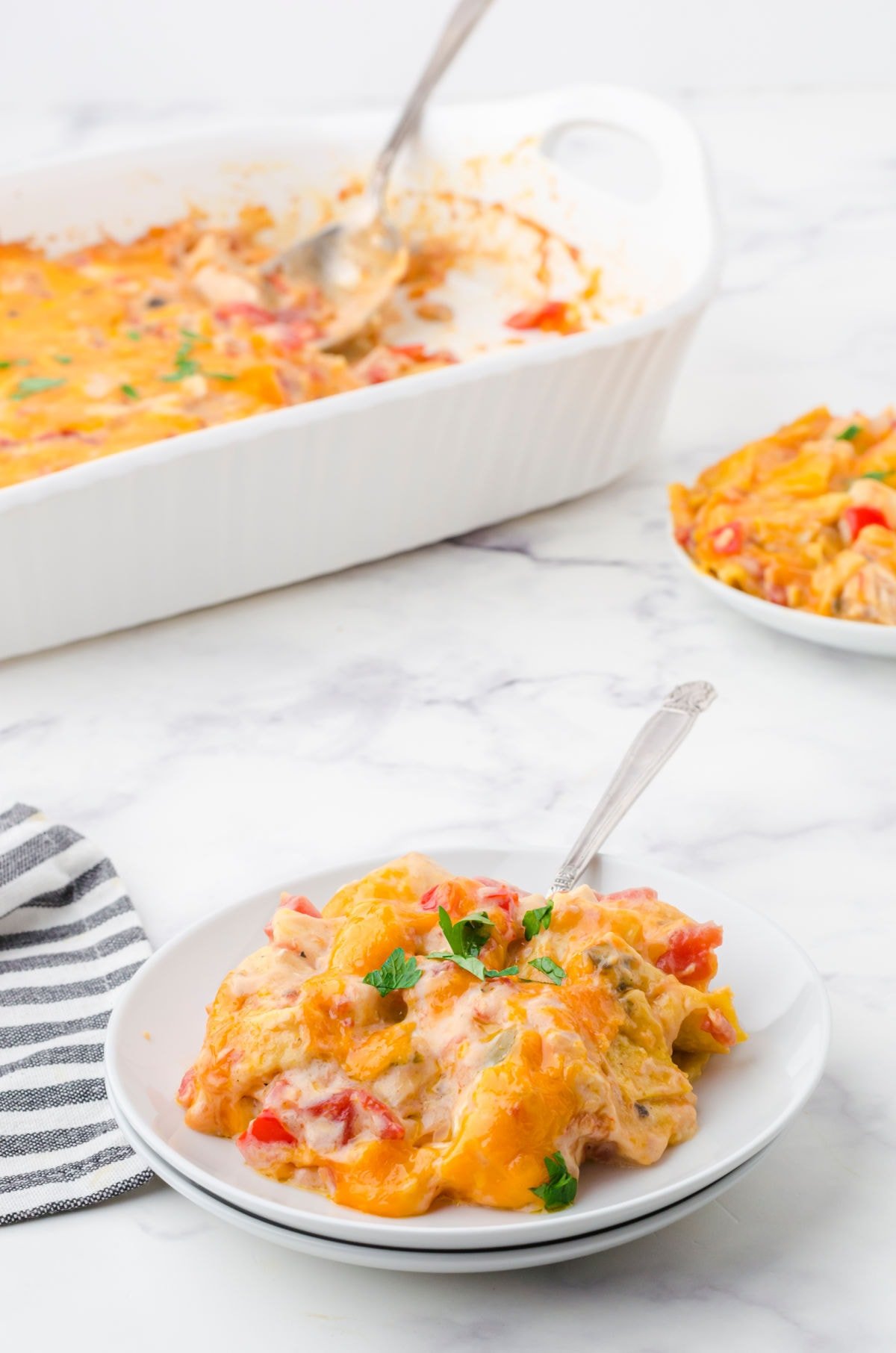 A plate of the casserole on a table.