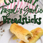 Breadsticks on a plate with text overlay for Pinteresst