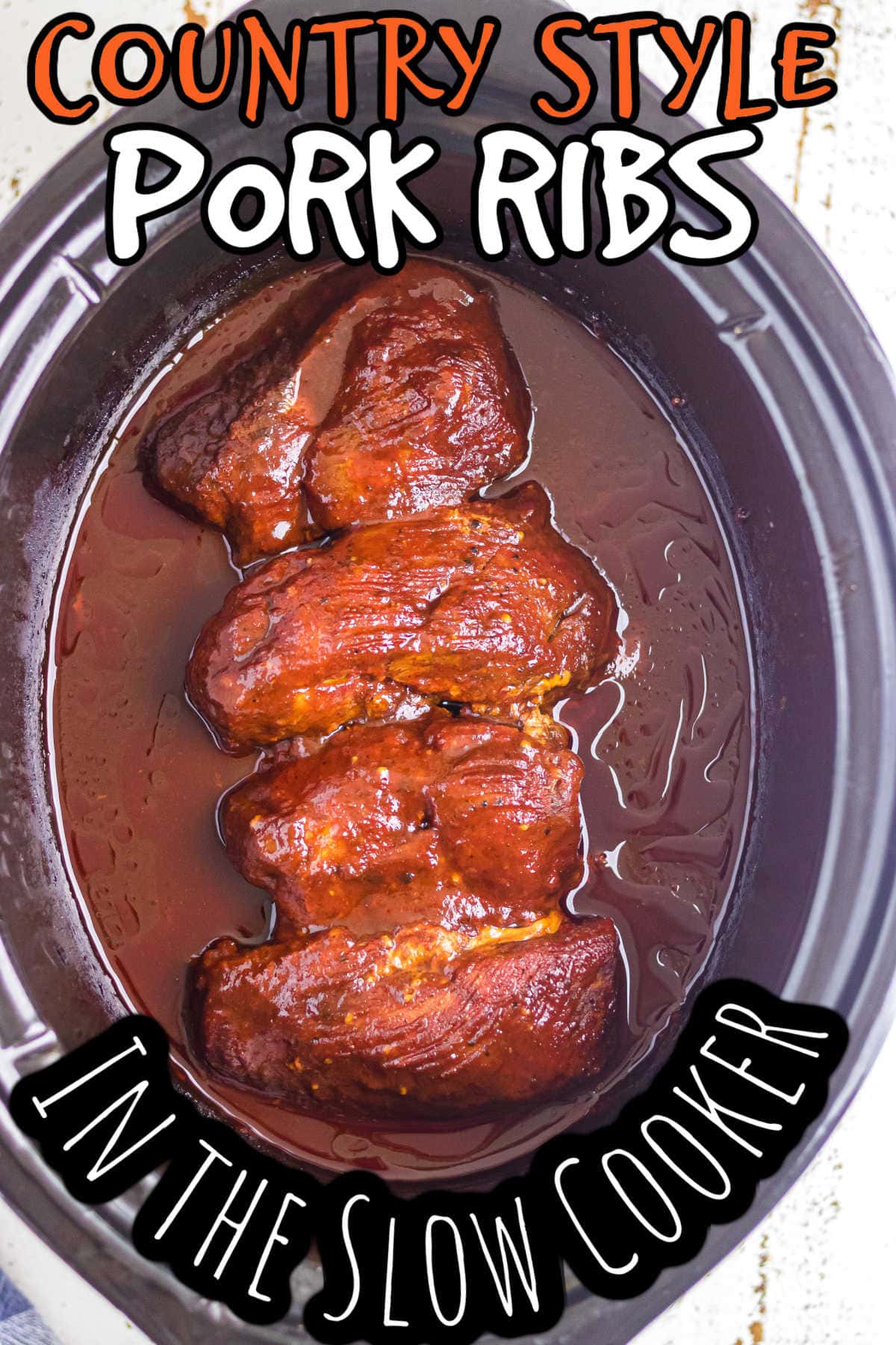 Overhead view of finished ribs in crockpot.
