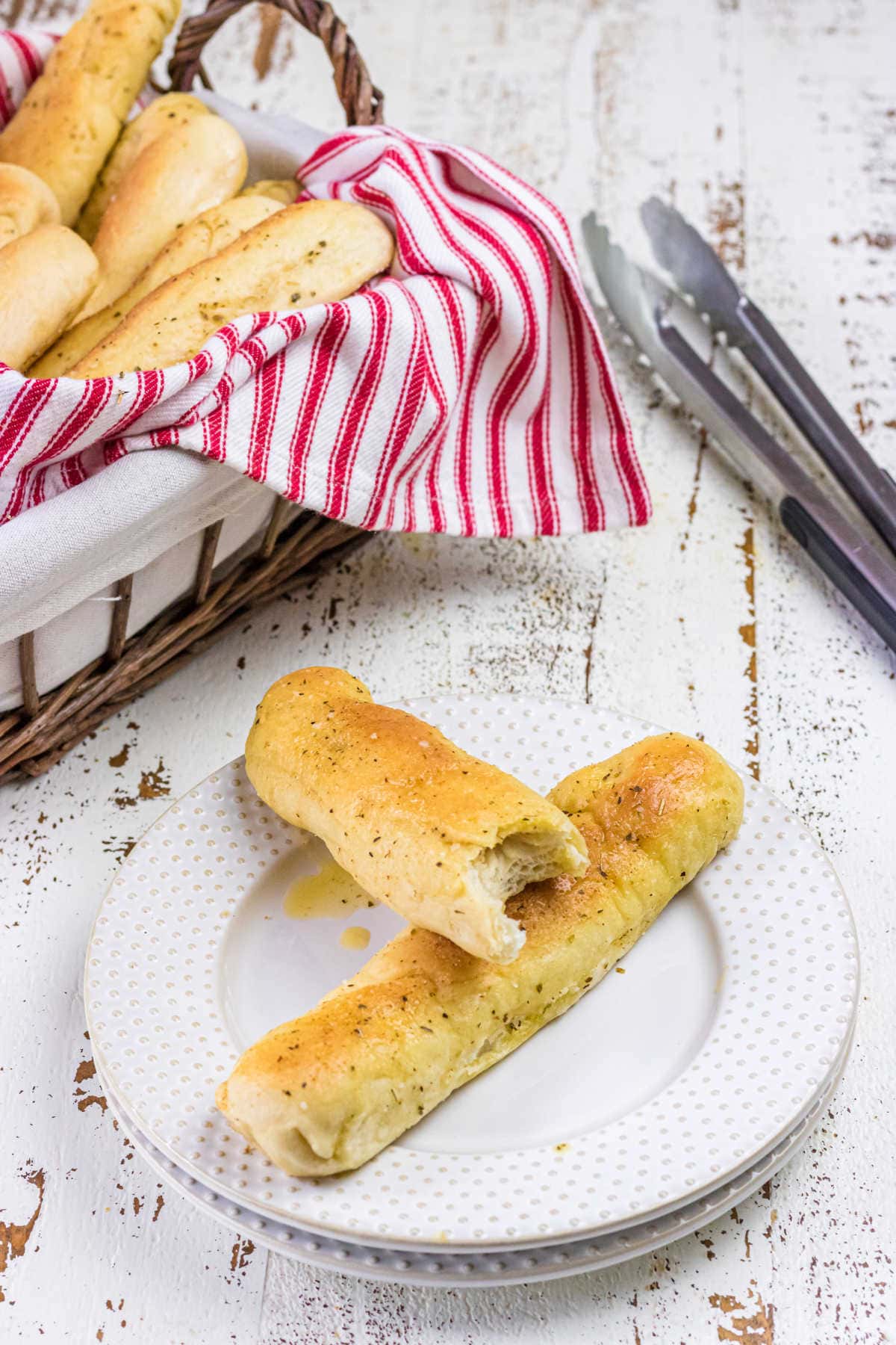 Decorative image of breadsticks on a plate.