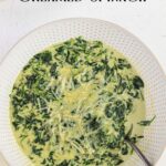 Overhead view of a bowl of creamed spinach.