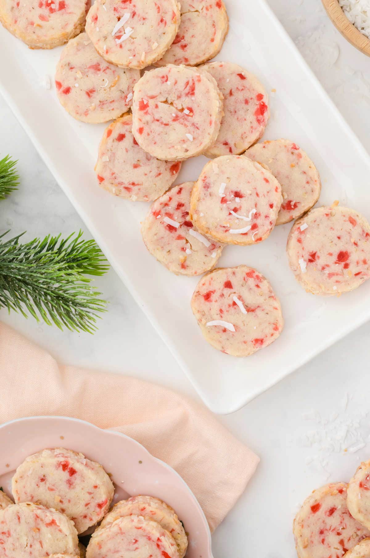 Overhead view of cookies on a white plate.