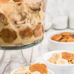 Side view of the banana pudding with title text overlay for Pinterest.