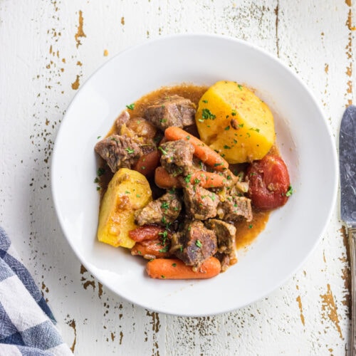 Overhead view of stew in a white bowl.