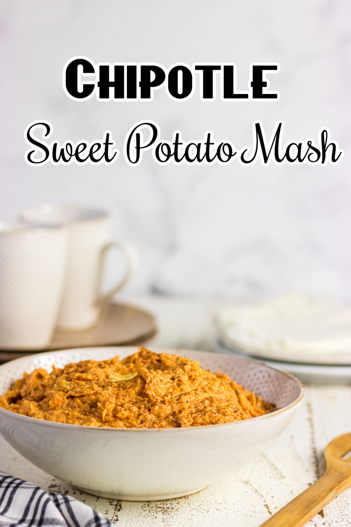 Side view of a bowl of sweet potatoes on a table.