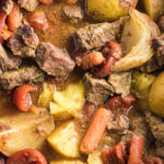 Overhead view of beef stew in a slow cooker for Pinterest