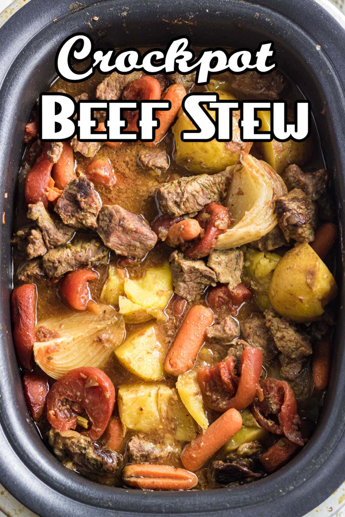 Overhead view of stew in the slow cooker with title text overlay.