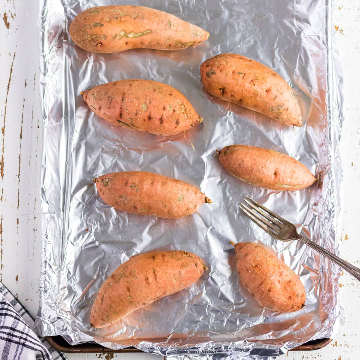 Overhead view of washed sweet potatoes.