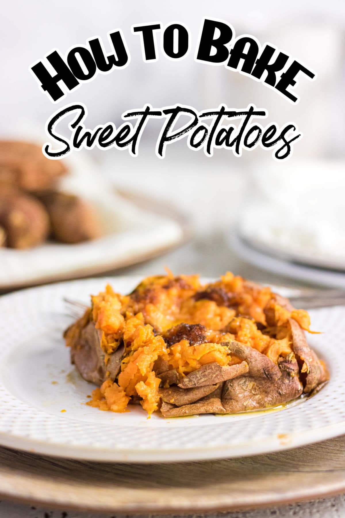 Baked sweet potato on a white plate.