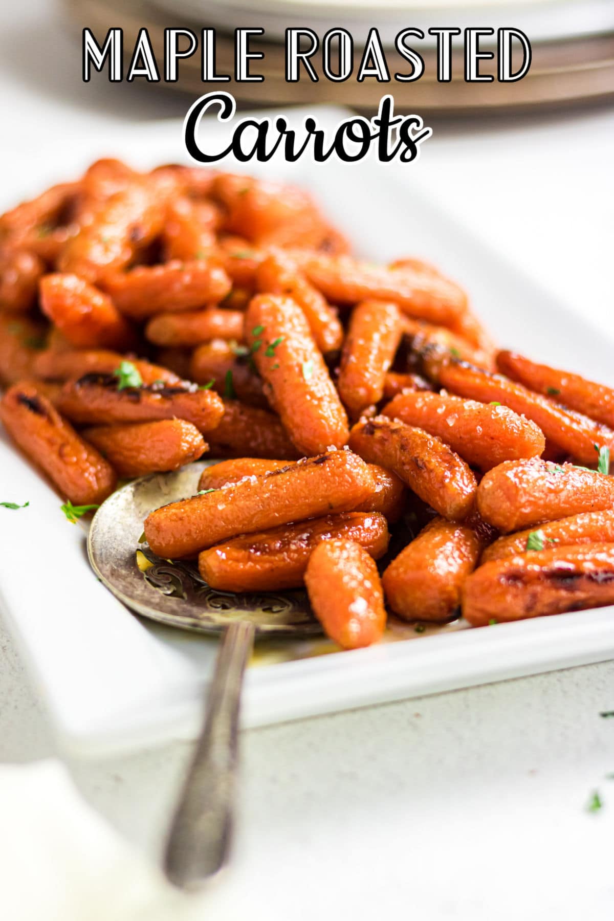 Finished carrots on a white platter with title text overlay.