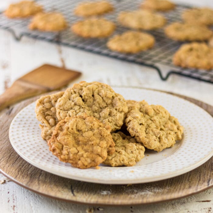 Closeup side view of cookies on a white plate.