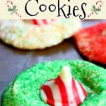 A sugar cookie rolled in green sugar with a peppermint kiss in the center. Text overlay for Pinterest.