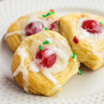 Close up of the sweet rolls on a white plate.