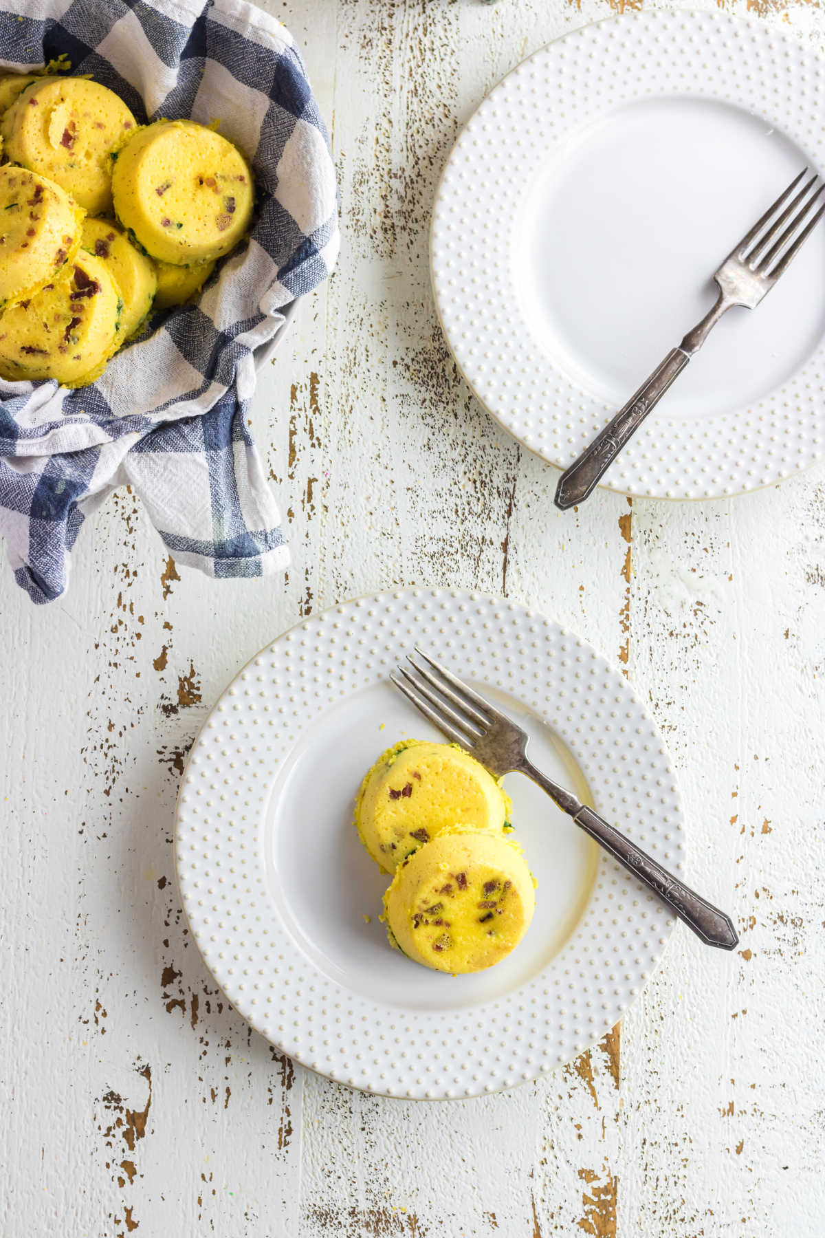 Overhead view of a table with the egg bites in a bowl.